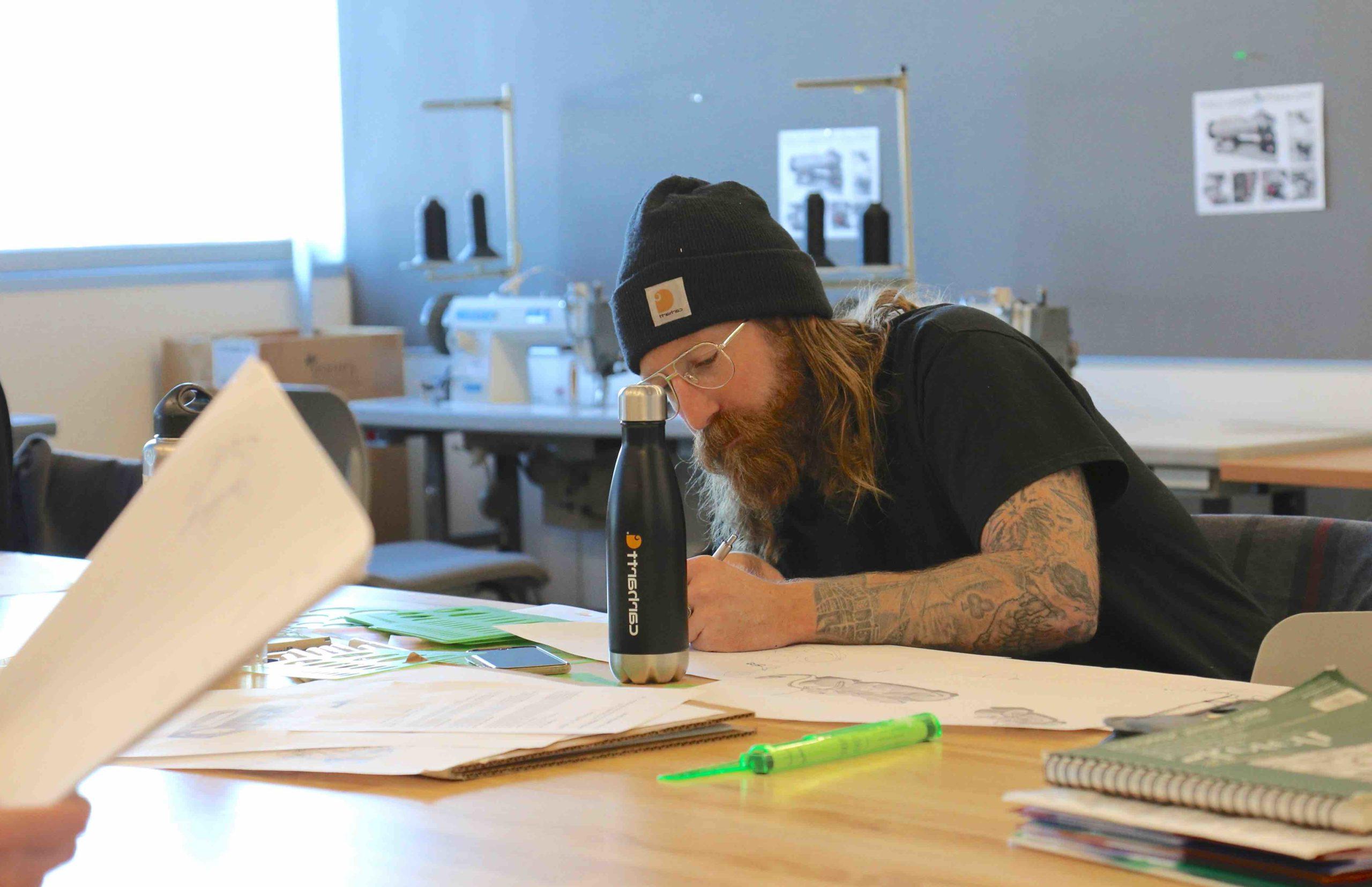 Student sketching in a classroom